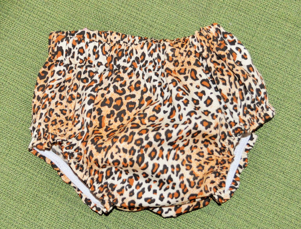 Leopard bloomers / Diaper Cover. Bloomers have big pink bow on back.